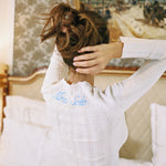 ALT's ivory Lark top shown from behind, personalized script embroidery visible at the shoulder.