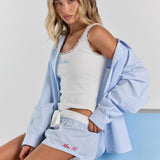 Blue stripe Beatrice drawstring short from a side angle, with personalized embroidery low on the leg and a loose, easy fit.