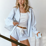ALT's blue stripe Beatrice drawstring short, shown from the front with a white ribbon tie, styled with a bridal veil.