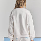White Bride Pia crew sweatshirt from behind, plain across the back with dropped shoulders and a ribbed neckline, cuffs and hem.