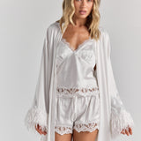 White Melita feather satin robe worn open, its feather cuffs framing the Eloise satin lace crop cami and the Gianna satin lace short.