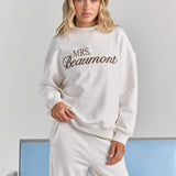 ALT's white Pia crew sweatshirt with personalized embroidery across the chest, dropped shoulders and ribbed neckline, cuffs and hem.