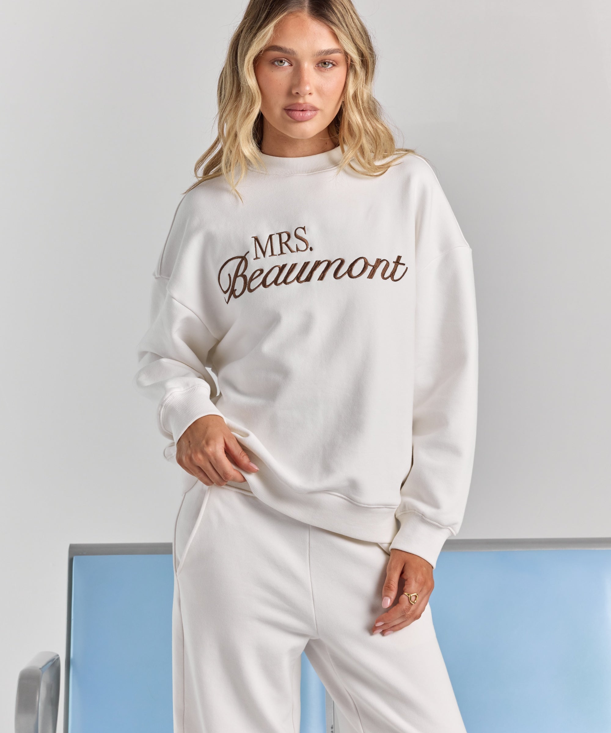 ALT's white Pia crew sweatshirt with personalized embroidery across the chest, dropped shoulders and ribbed neckline, cuffs and hem.