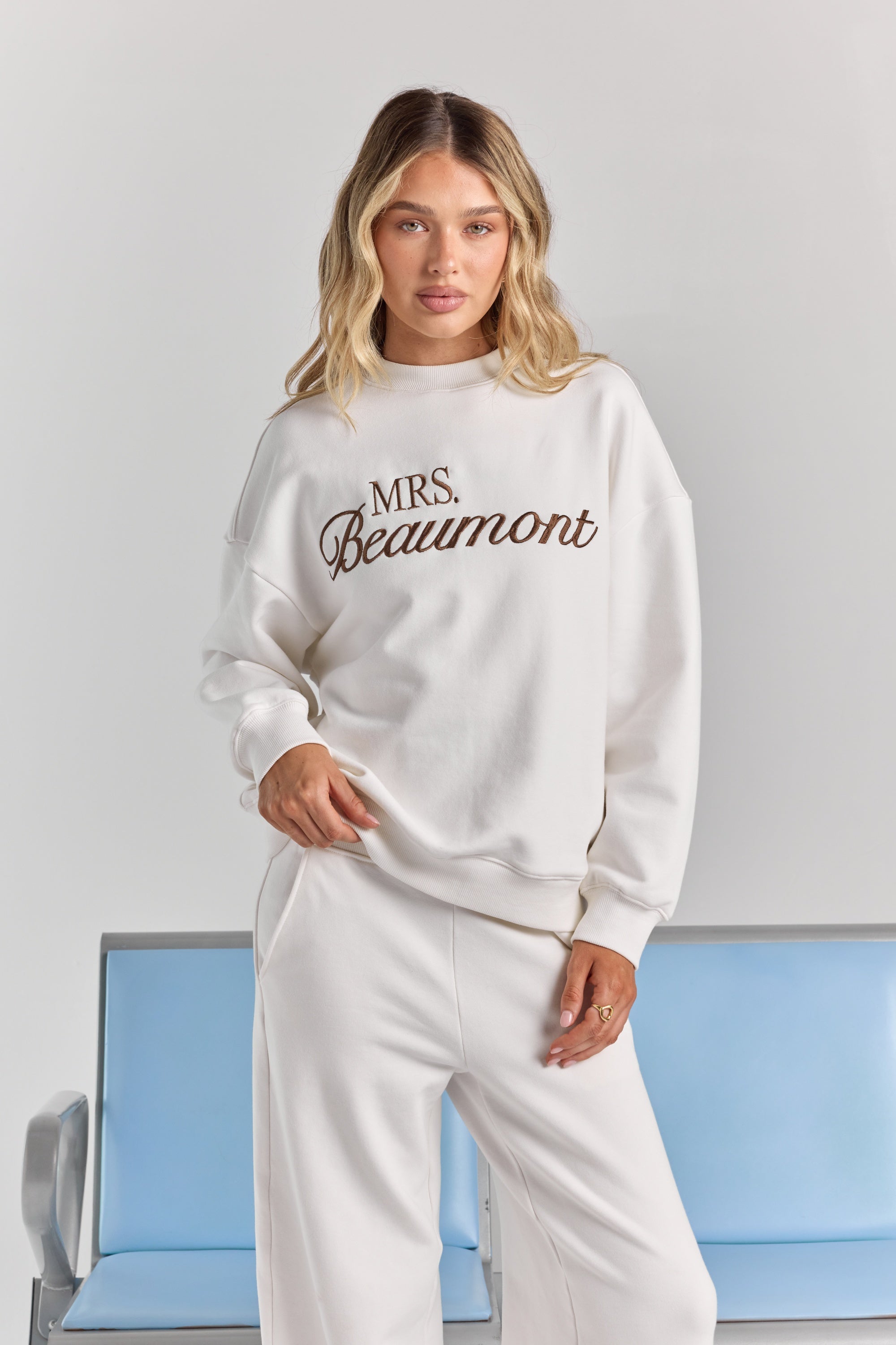 ALT's white Pia crew sweatshirt with personalized embroidery across the chest, dropped shoulders and ribbed neckline, cuffs and hem.