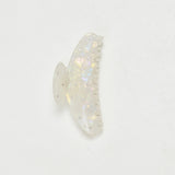ALT's iridescent Gia claw clip, a product shot of the shifting pink and green finish scattered with rhinestones.