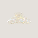 ALT's iridescent Gia claw clip, shown on its own from the front, the shimmering finish dotted with rhinestones.