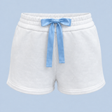 White Bride Althea track short shown on its own from the front, with a blue satin bow tied at the elasticated waist and a short hem.
