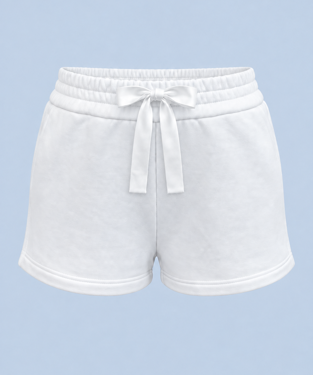 White Althea track short shown on its own from the front, with a white drawstring bow at the double elasticated waist.