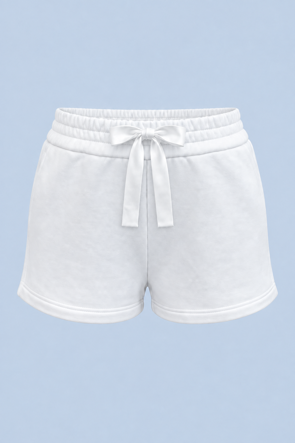 White Althea track short shown on its own from the front, with a white drawstring bow at the double elasticated waist.
