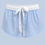Blue stripe Beatrice drawstring short shown on its own from the front, with a white ribbon tie, white contrast waistband and button front.