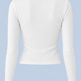 White Cleo long sleeve top shown on its own from behind, with a round back neckline, ribbed fabric and a cropped hem.