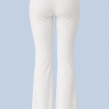 White Frankie foldover ribbed pant shown on its own from behind, with a fold-over waistband and a flared leg.