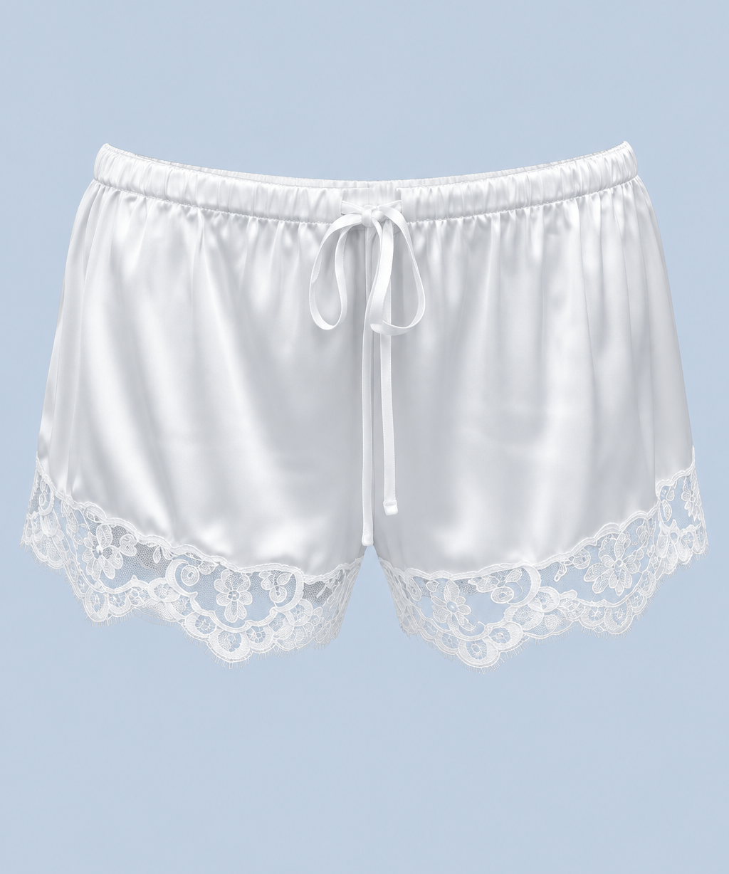 White Gianna satin lace short shown on its own from the front, with a drawstring tie, elasticated waist and floral lace at each leg.
