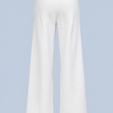 White Paola trackpant shown on its own from the back, plain with an elasticated waistband and a wide straight leg.