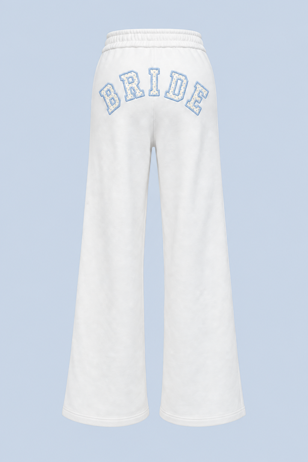 ALT's white Bride Paola trackpant shown on its own from behind, with BRIDE in blue-outlined varsity applique arched high across the back.