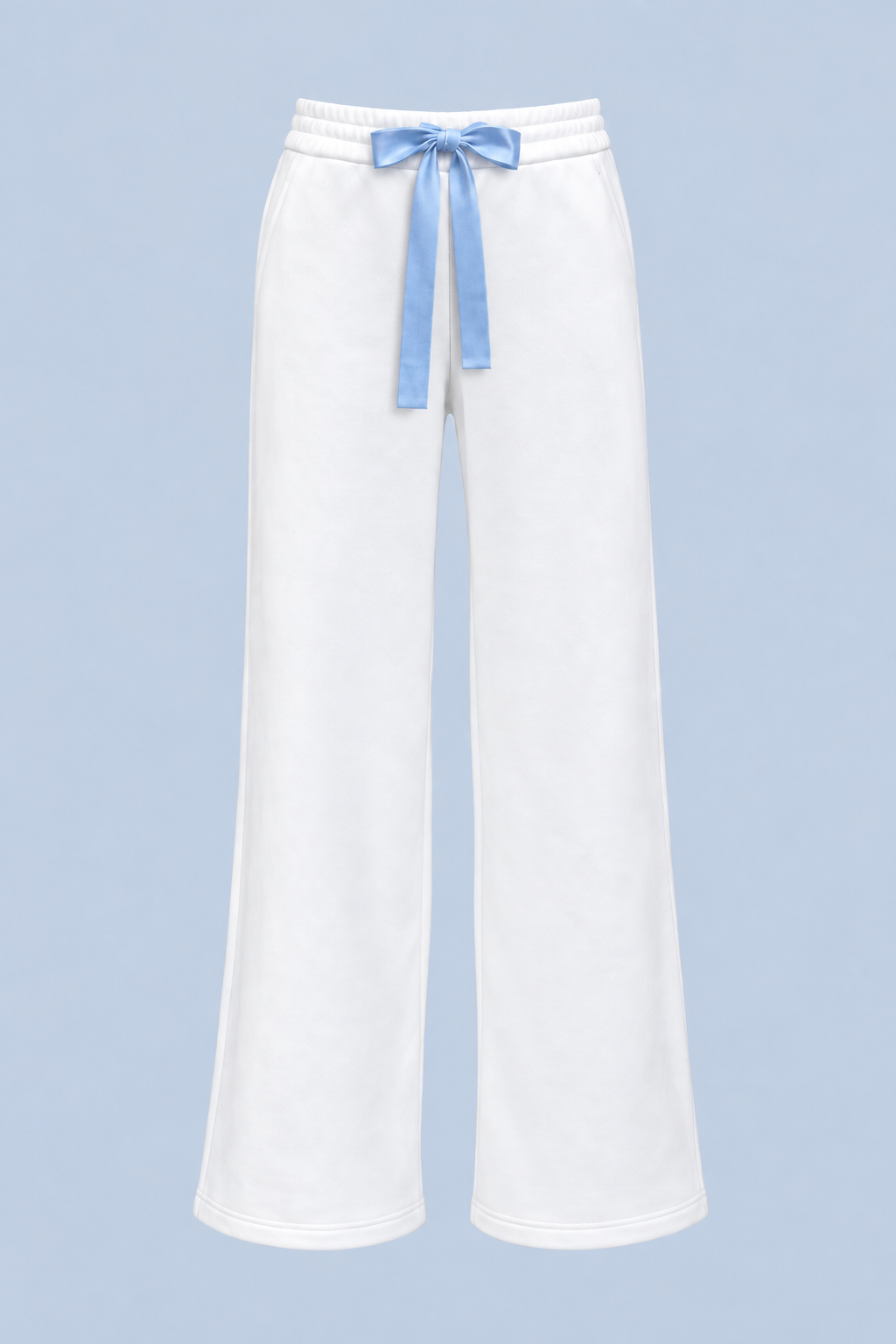 White Bride Paola trackpant shown on its own from the front, with a blue satin bow tied at the elasticated waist and a wide straight leg.