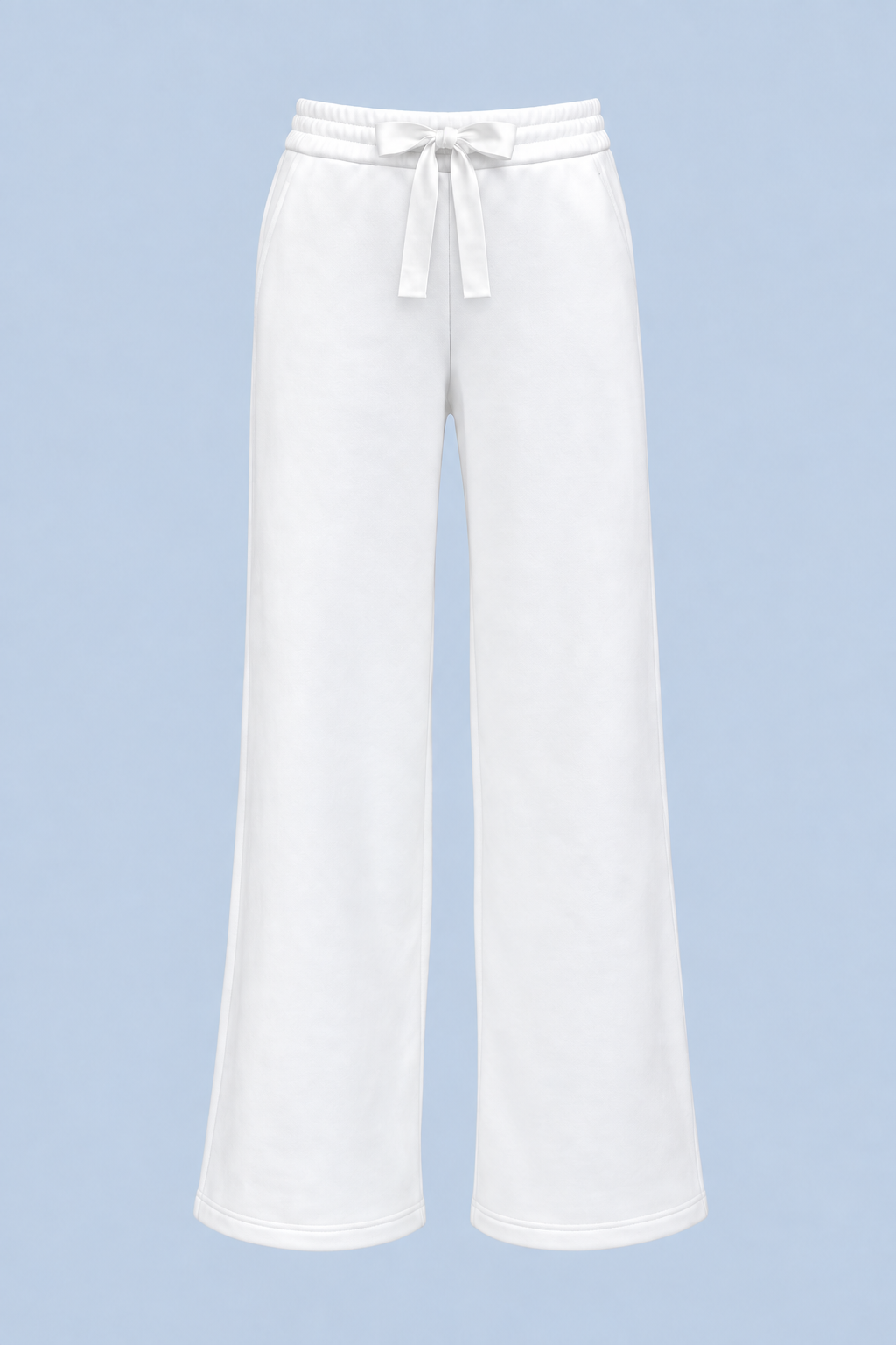 White Paola trackpant shown on its own from the front, with a satin ribbon bow at the elasticated waist and a wide straight leg.