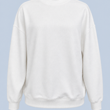 White Pia crew sweatshirt shown on its own from the front, plain with dropped shoulders and a ribbed crew neck, cuffs and hem.