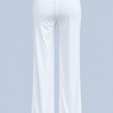 White Vivienne travel pant shown on its own from behind, with a flat waistband, a center back seam and a wide straight leg.