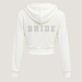 ALT's white Wifey rhinestone velour zip hoodie, seen from behind on a ghost mannequin with BRIDE in rhinestones.
